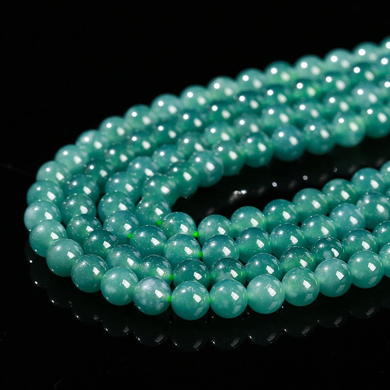 Loose natural jadeite beads ideal for DIY jewelry or beaded bracelets.