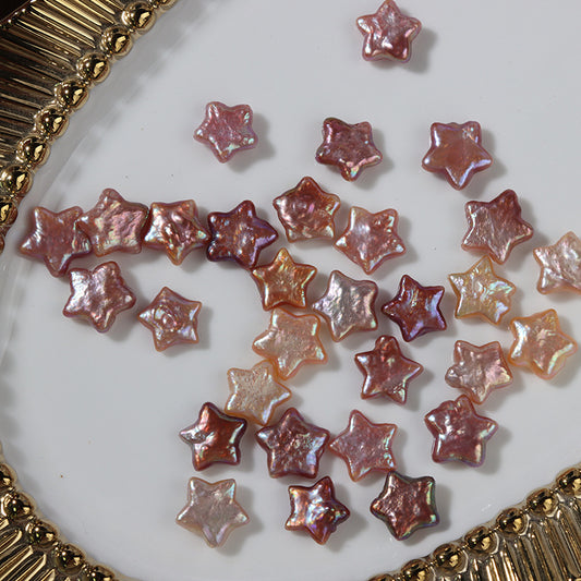 Natural star-shaped pearls displayed on a white plate with golden rim