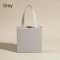 Grey jewelry drawer box with white ribbon handle
