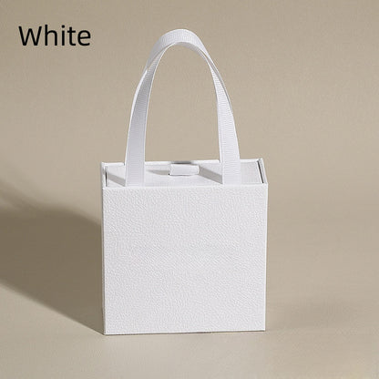 White jewelry drawer gift box with ribbon handle and foam insert