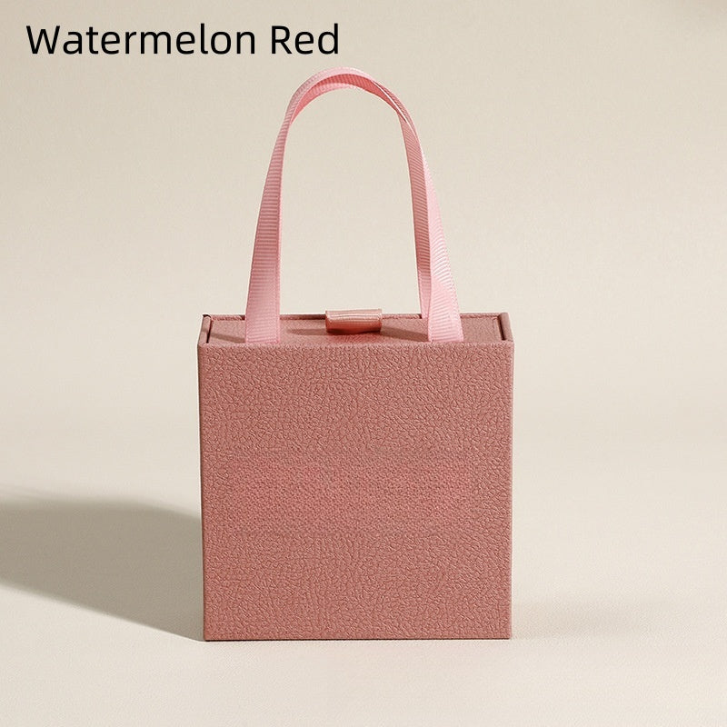 Watermelon red jewelry gift box with ribbon handle