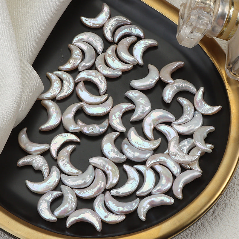 White crescent pearls arranged neatly under soft fabric