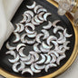 White crescent pearls arranged neatly under soft fabric